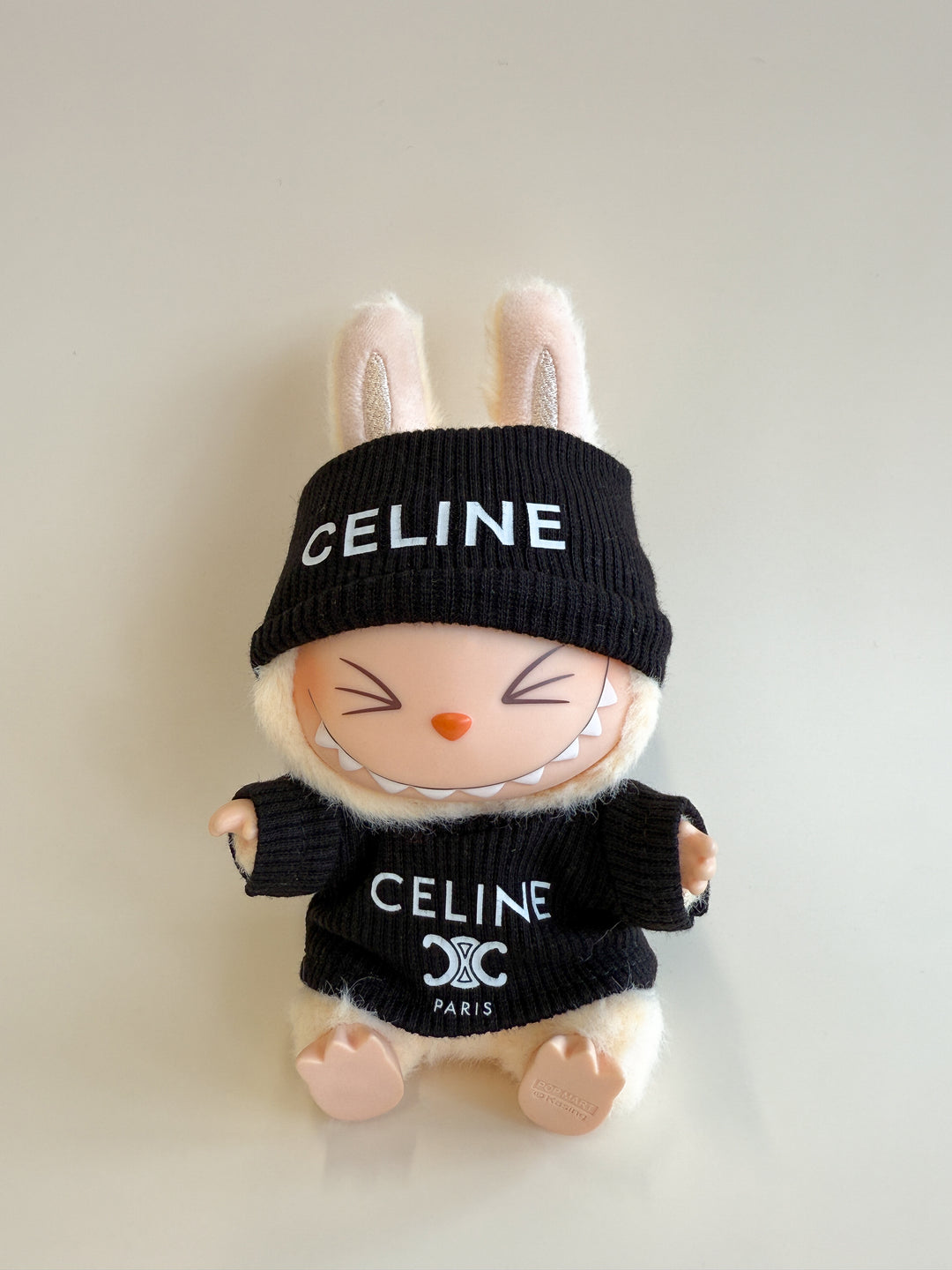 Plush toy rabbit wearing a black 'CELINE' outfit on a light background
Labubu Celine Accessories
Labubu Celine Clothes
Labubu Celine Fashion
Labubu designer fashion
Labubu Celine Outfit