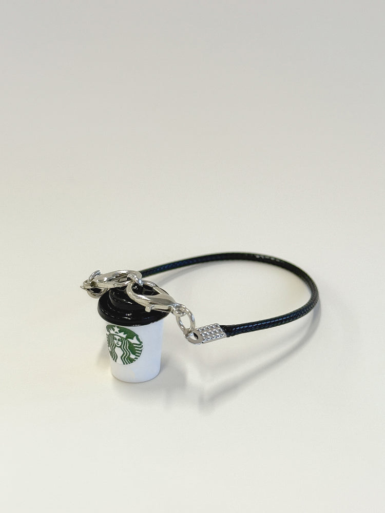 Starbucks cup-shaped keychain with black band on a white background
Labubu accessories
Labubu Starbucks accessories